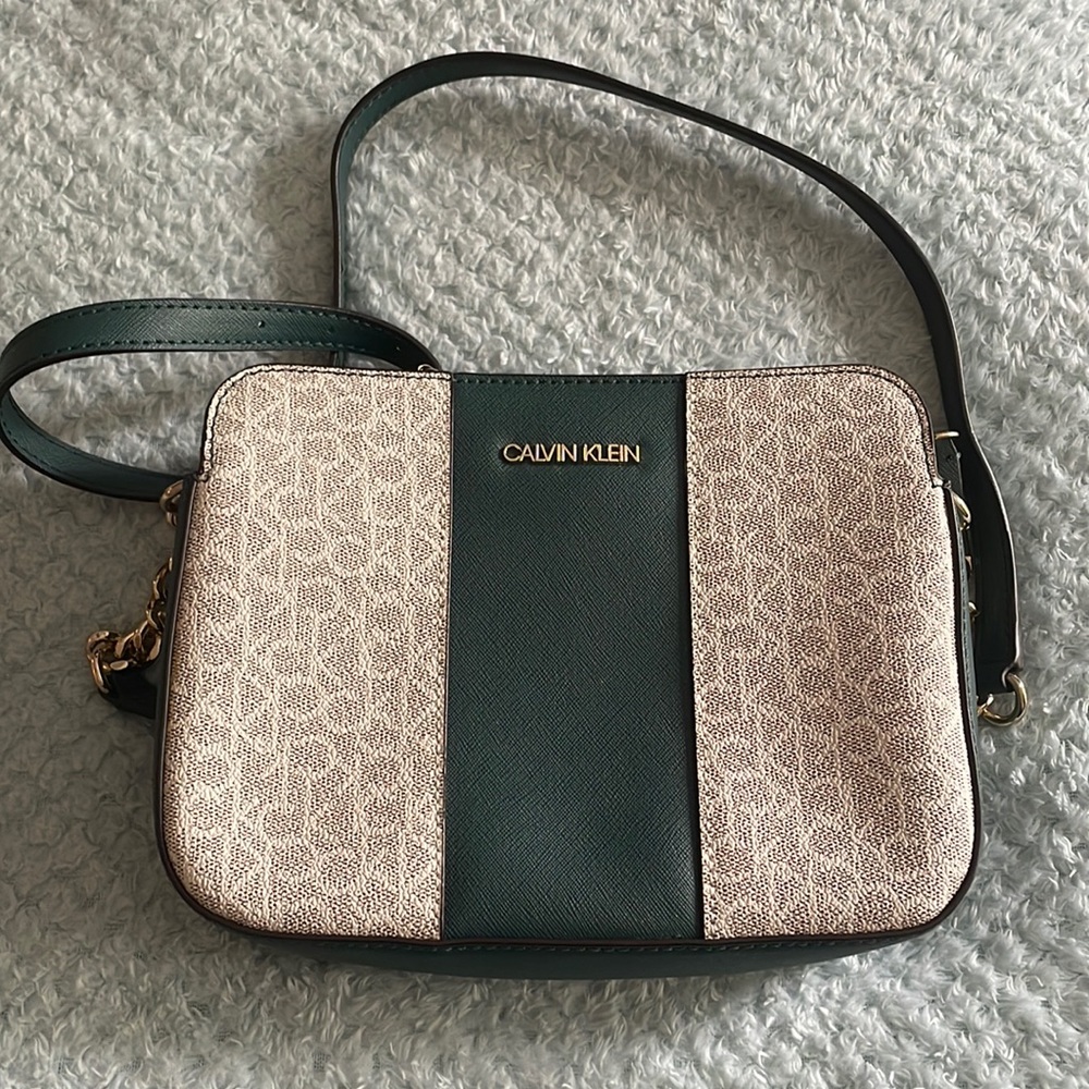 Dark green Calvin Klein bag with over the shoulder green and gold strap